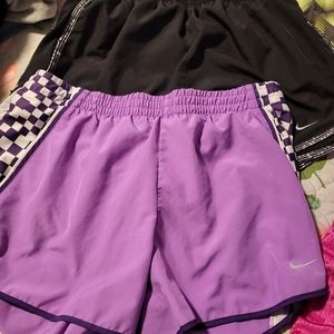 Lot of 5 pairs of Nike shorts, 1 pair of Adidas shorts.